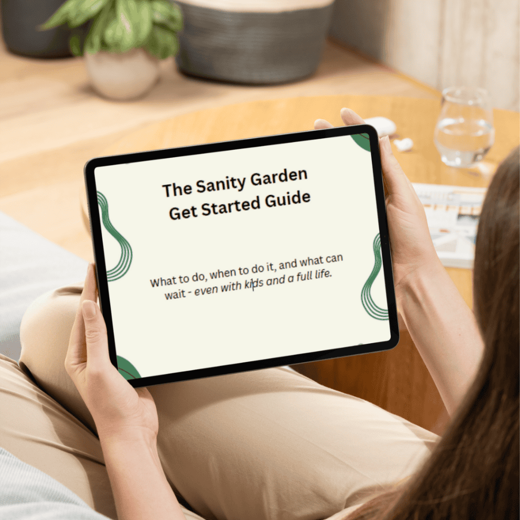 The Sanity Garden's Native Garden Get Started Guide mockup - a woman holds a tablet with a picture of the PDF guide on the display. 